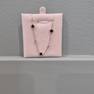 Elegant Gold and Black Clover Necklace